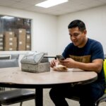 Warehouse worker eating lunch in a breakroom